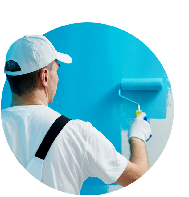 Painter rolling a wall